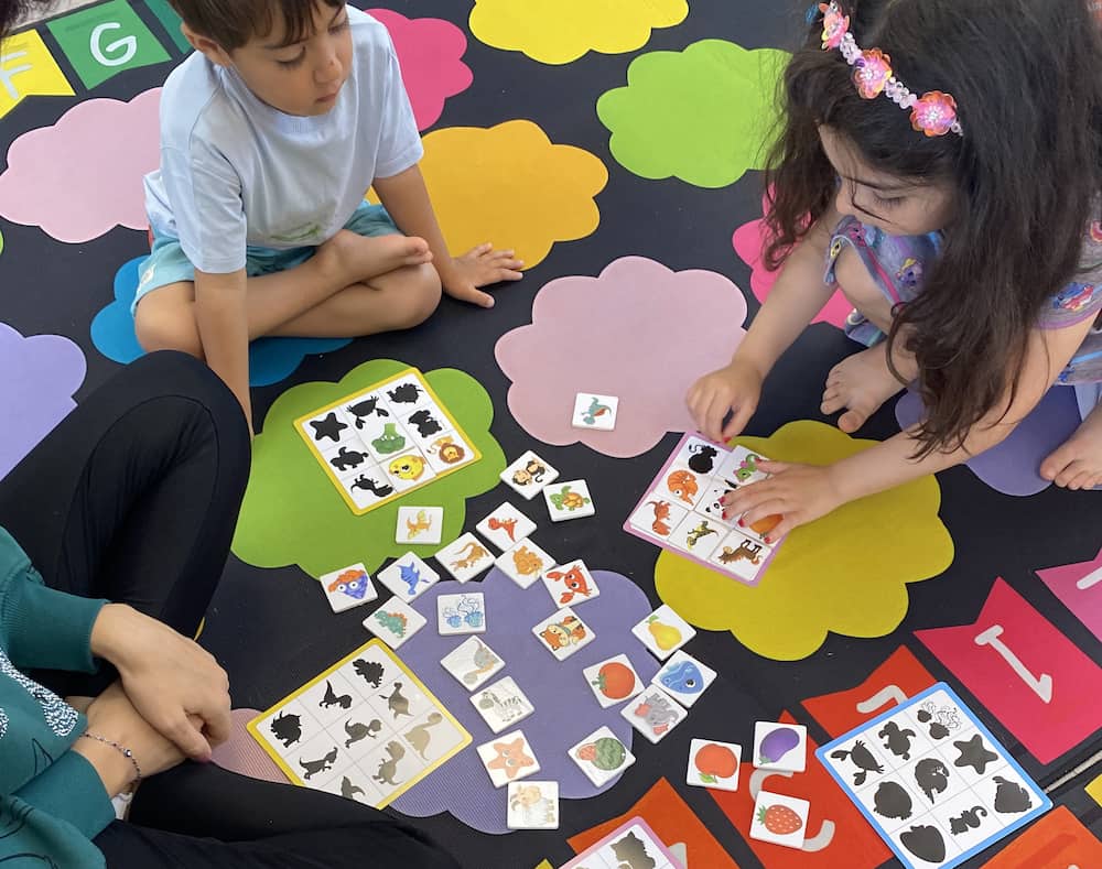Children participating in a purposeful play activity at Rose Child Care Center in North Vancouver guided by a child psychologist